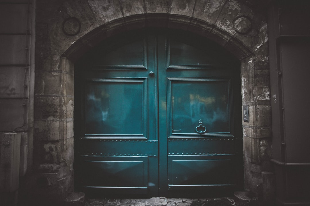A teal door in Paris