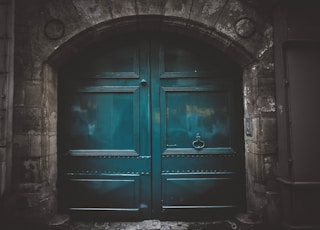 blue wooden double arch door s