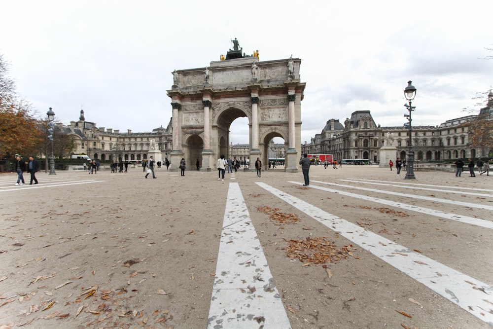 A bunch of people walking through a city in France.