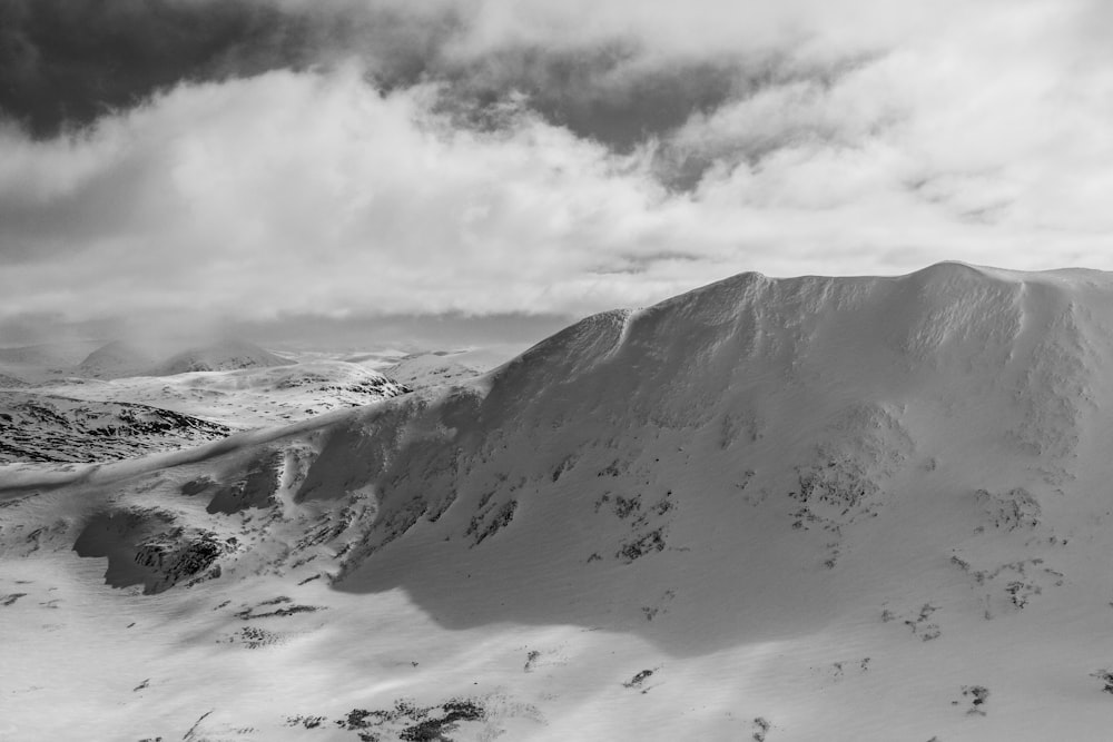 mountain covering white snow during daytime