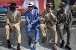 A group of men in diverse outfits, exuding confidence and style.