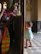 Father warmly greeting a cheerful teacher at the kindergarten entrance.