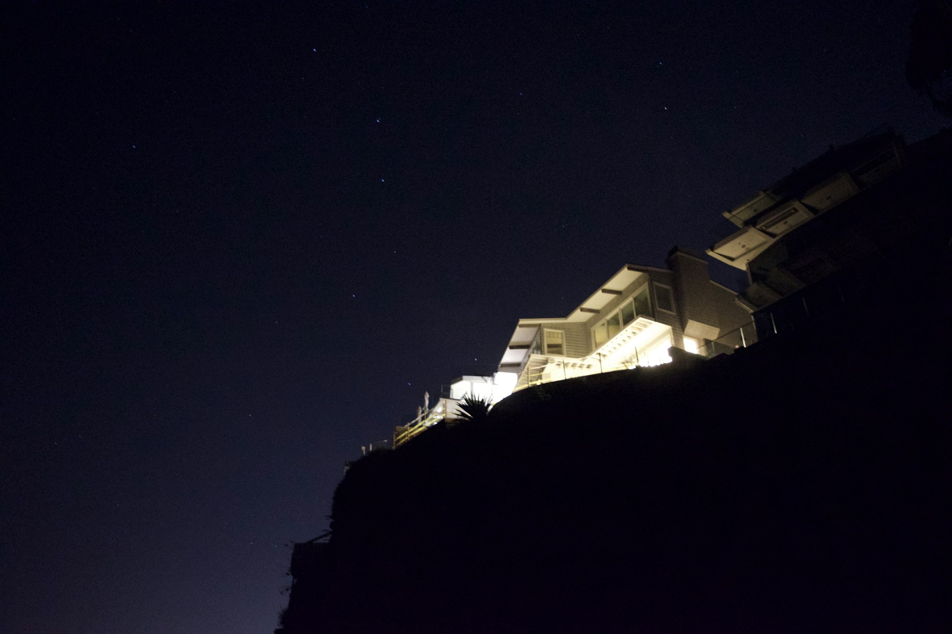 A sleek modern home photographed with crisp lighting and sharp angles, emphasizing the detail and style of real estate photography.