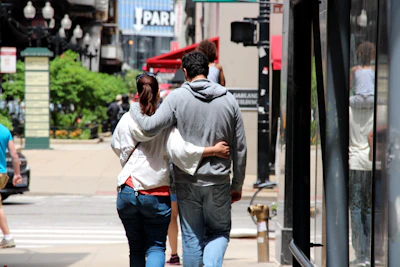 Couple exploring a vibrant cityscape during a carefully planned trip.