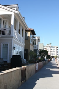 Street view of a residential area with diverse homes.
