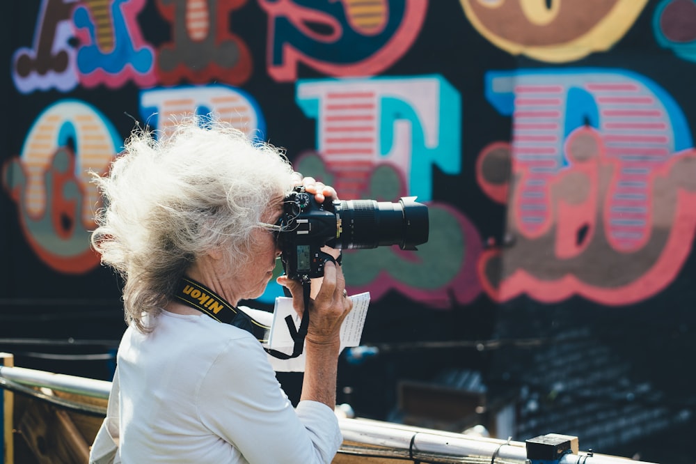 a woman taking a picture with a camera