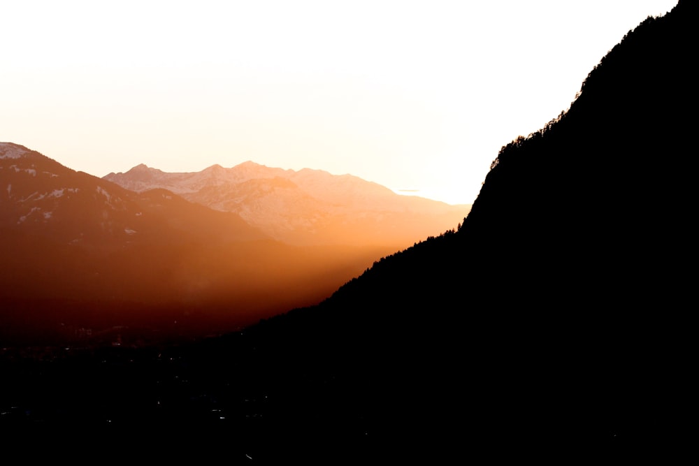 silhouette of mountain during sunset