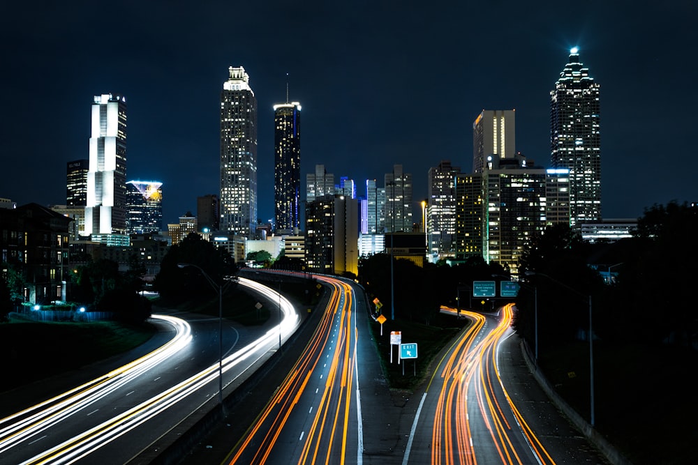 time lapse photo of passing cars during night time