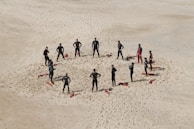 people standing forming a circle during daytime