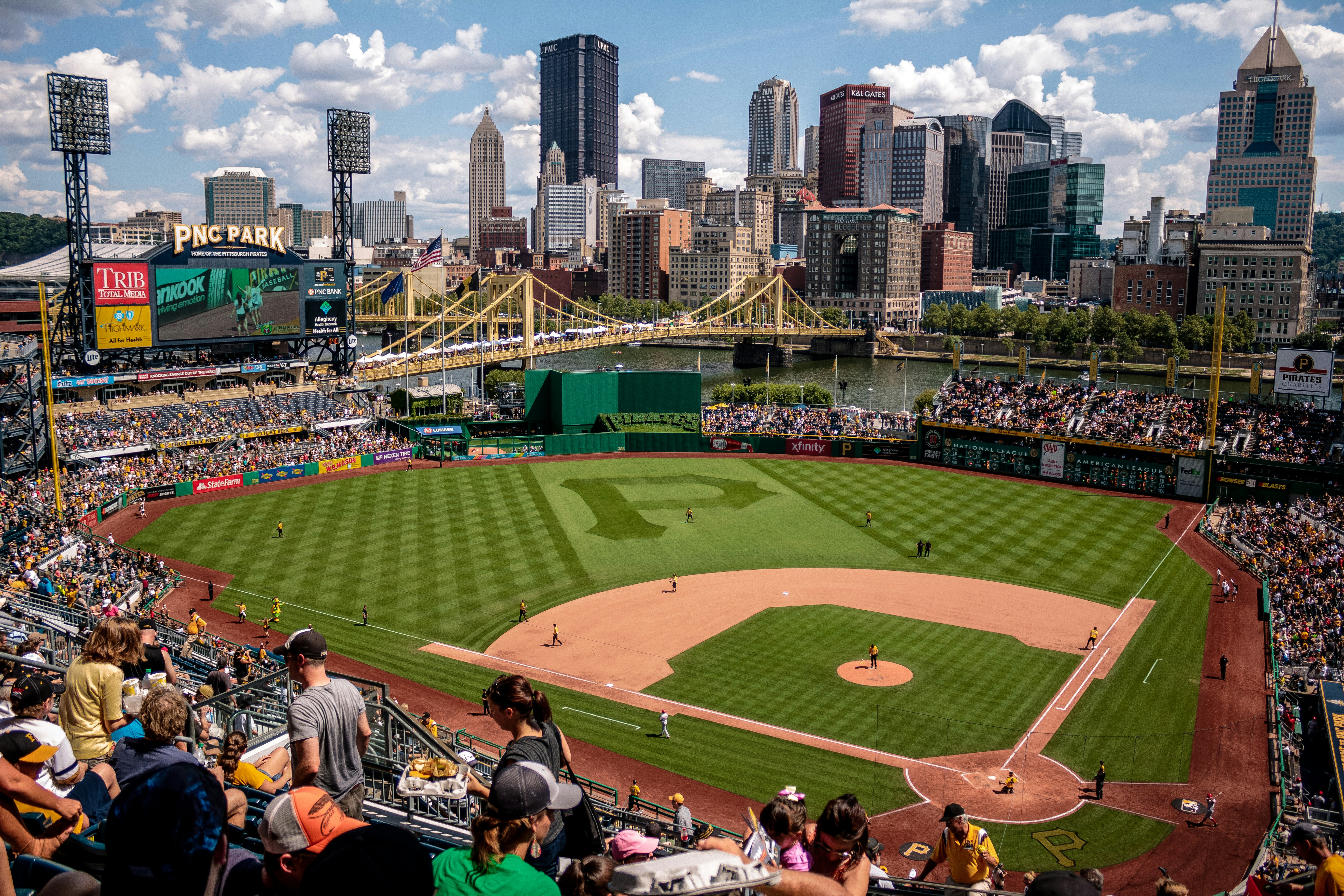 game at baseball court surrounded by fans