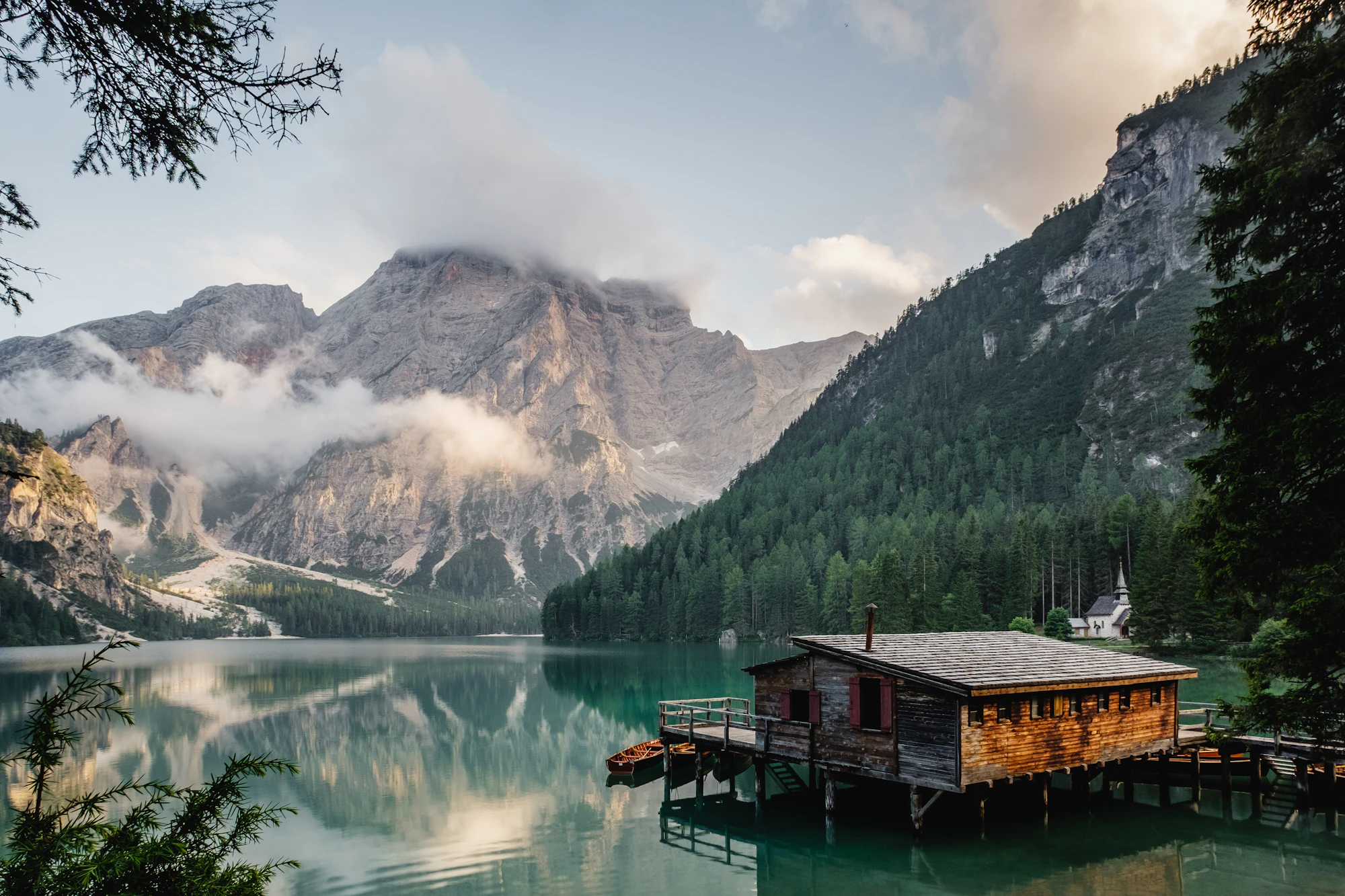 Still lake beneath distant mountains
