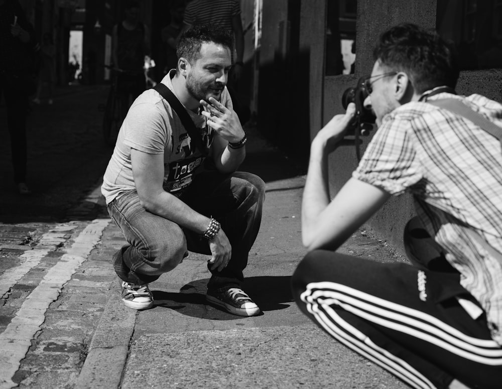 two men kneeling down