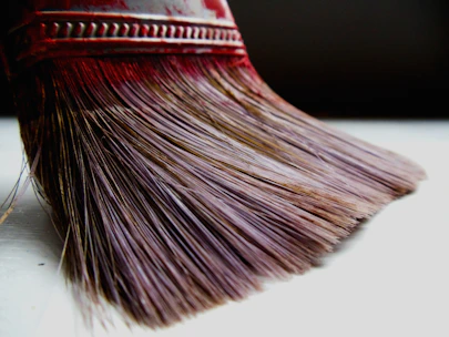 Close-up of natural bristles being carefully selected in a workshop.
