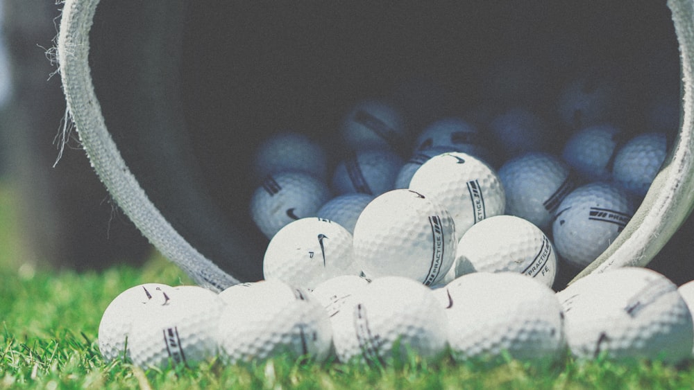 shallow focus photography of white golf balls