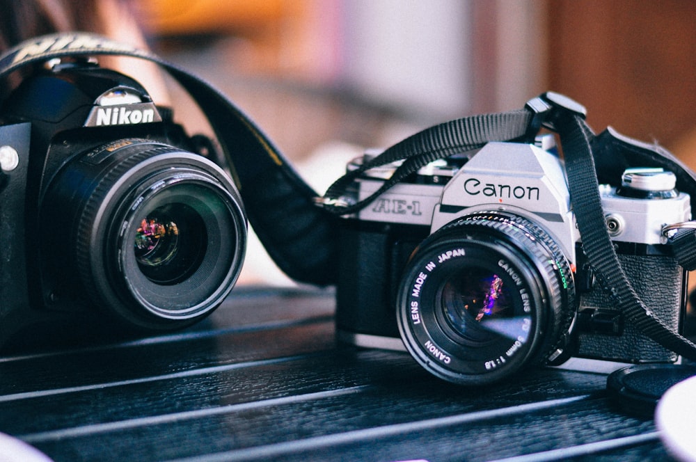 black Canon and Nikon camera in macro shot photography