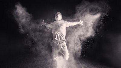 Dynamic shot of Geerbounce in motion, surrounded by subtle white smoke on black.