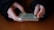 A close-up of hands interacting with a tablet, showcasing a vibrant and engaging app design.