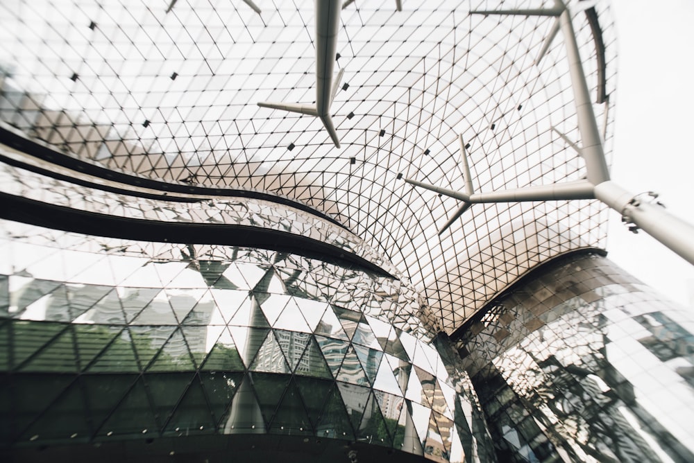 a building with a glass roof and a sky background