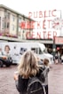 woman standing in front of Public Market Center