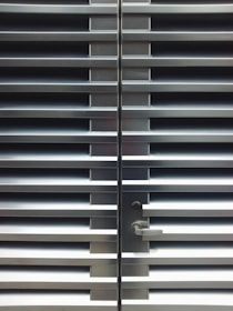 Custom-made aluminum doors in a stylish commercial space.