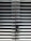 A metallic or aluminum louvered door with horizontal slats and a silver handle on one side. The door is symmetrical and provides a sleek, industrial aesthetic.