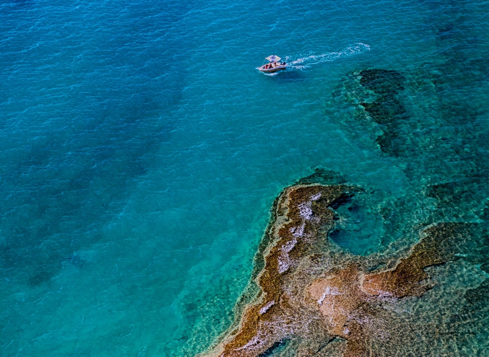 aerial photography of boat on body of water