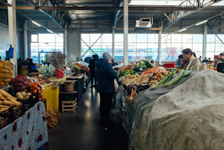 Close-up of fresh produce and market stalls bathed in natural light.