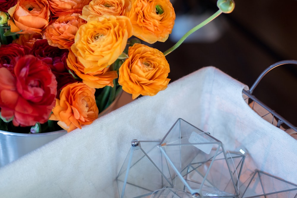 orange and red rose arrangement