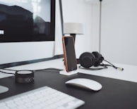 Close-up of a sleek docking station with keyboard, mouse, and monitor setup.