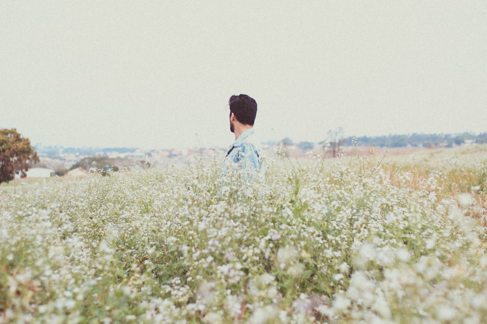 man in garden of flowers