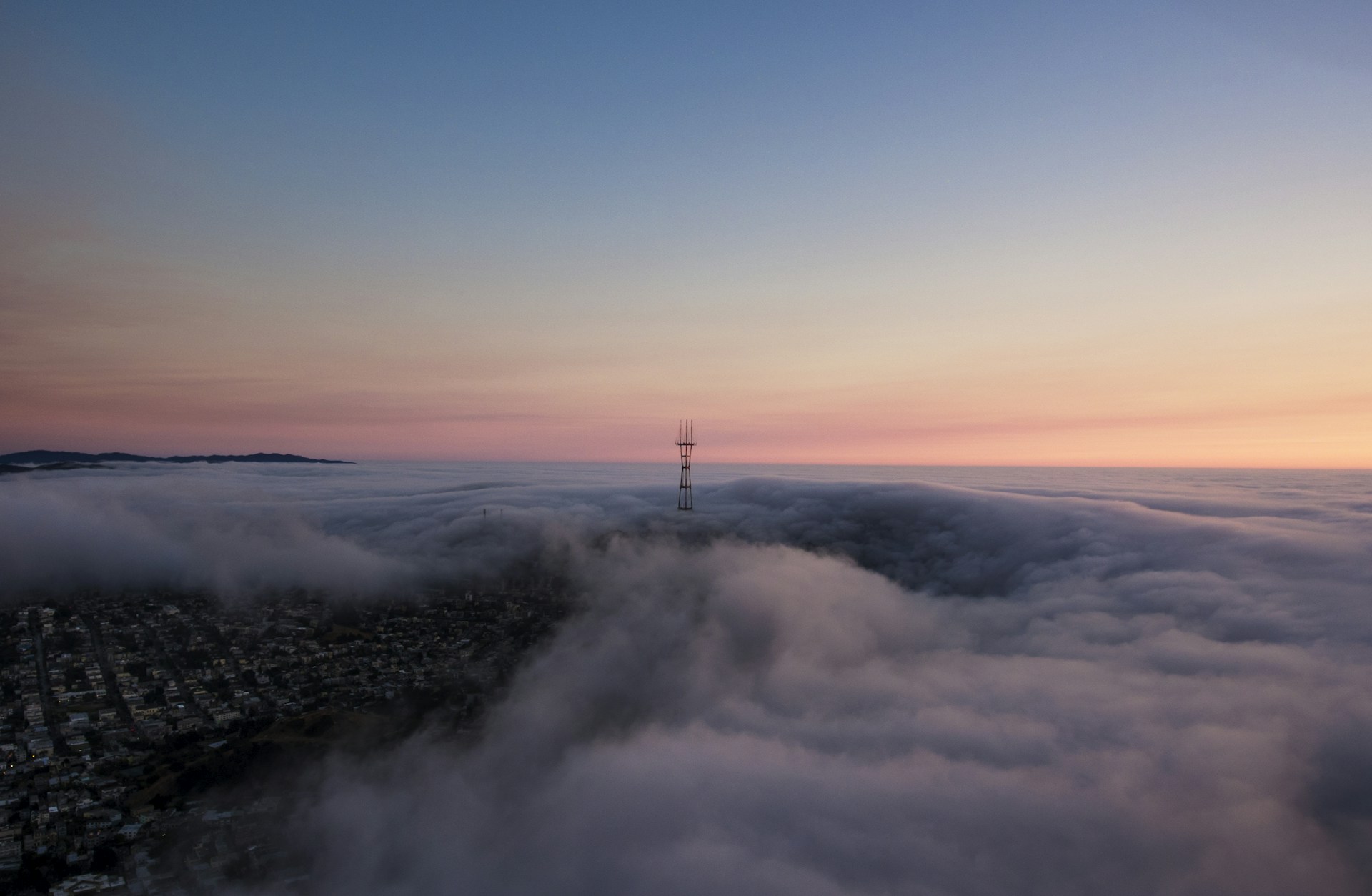 tower surrounded by clouds