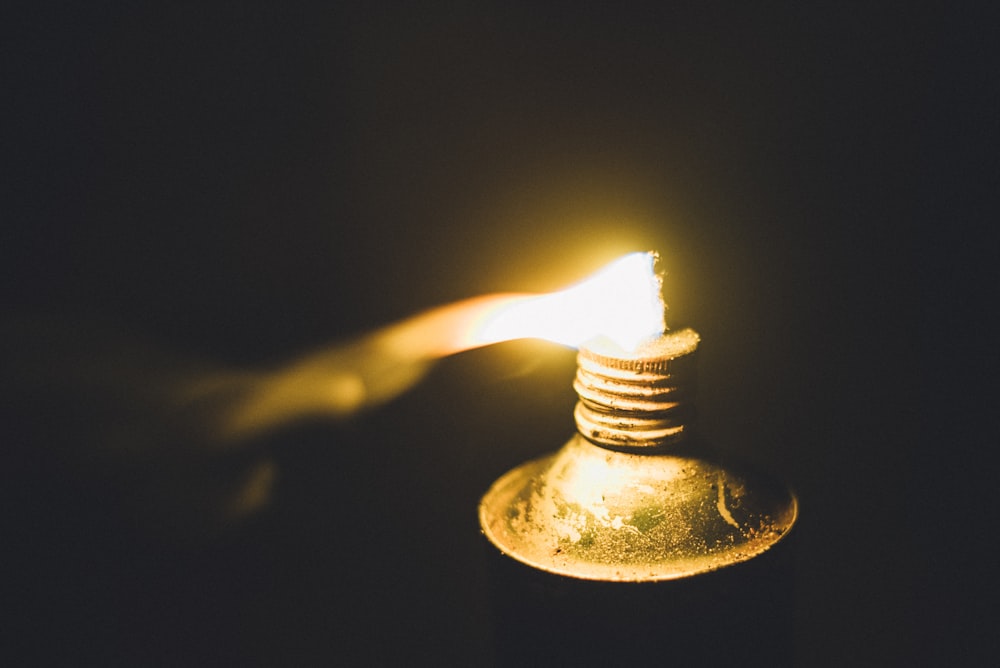 a small light bulb is lit up in the dark