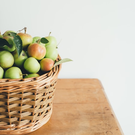 green fruits in basket