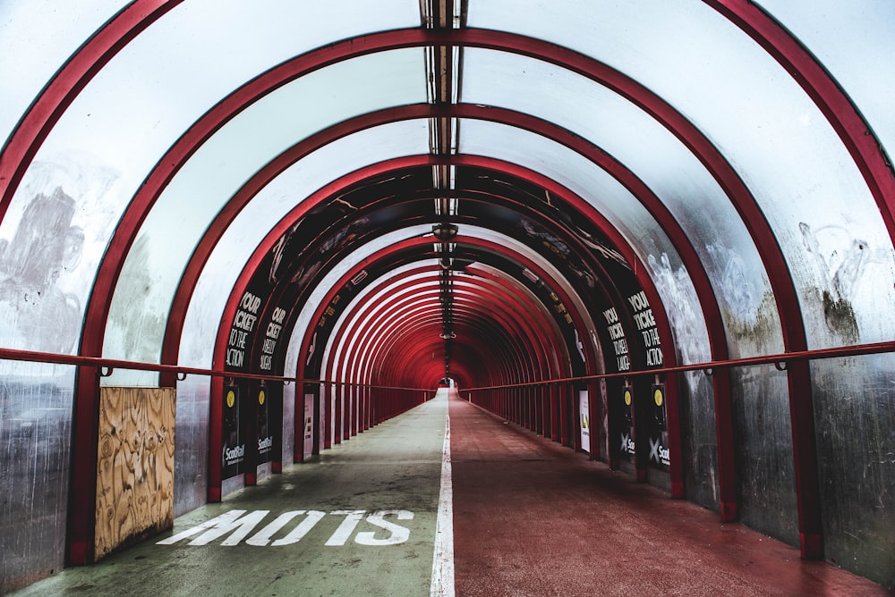 empty red and white glass tunnel