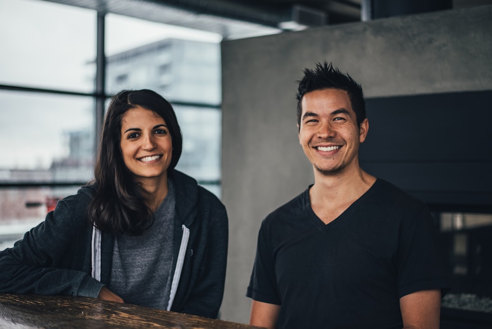 Man and woman smiling contentedly inside a loft