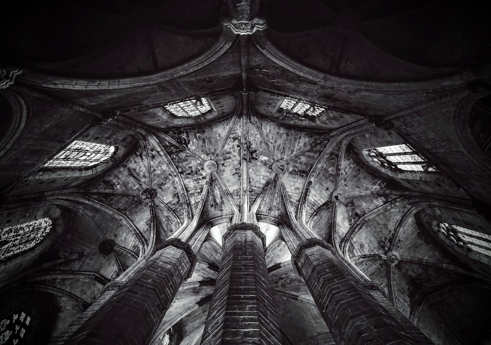 grayscale photo of concrete building interior