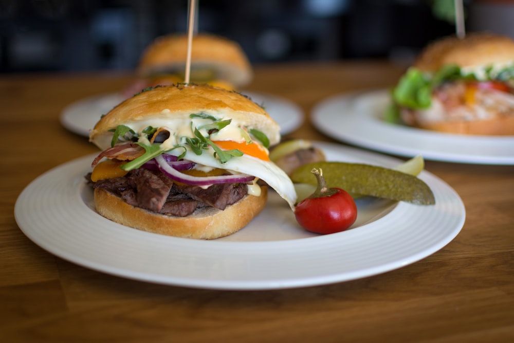 three plate of burgers