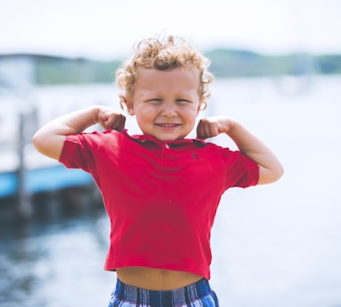 boy standing near dock