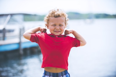 boy standing near dock