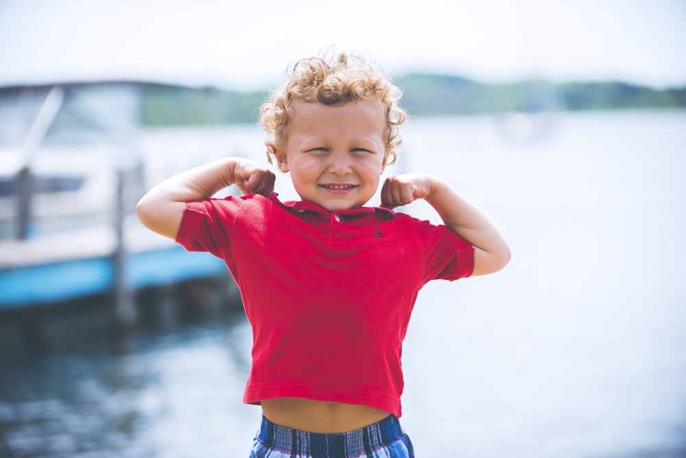 boy standing near dock