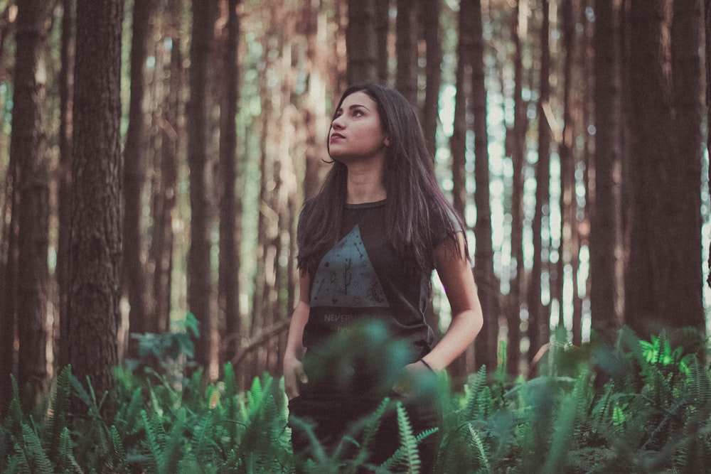 woman standing near trees