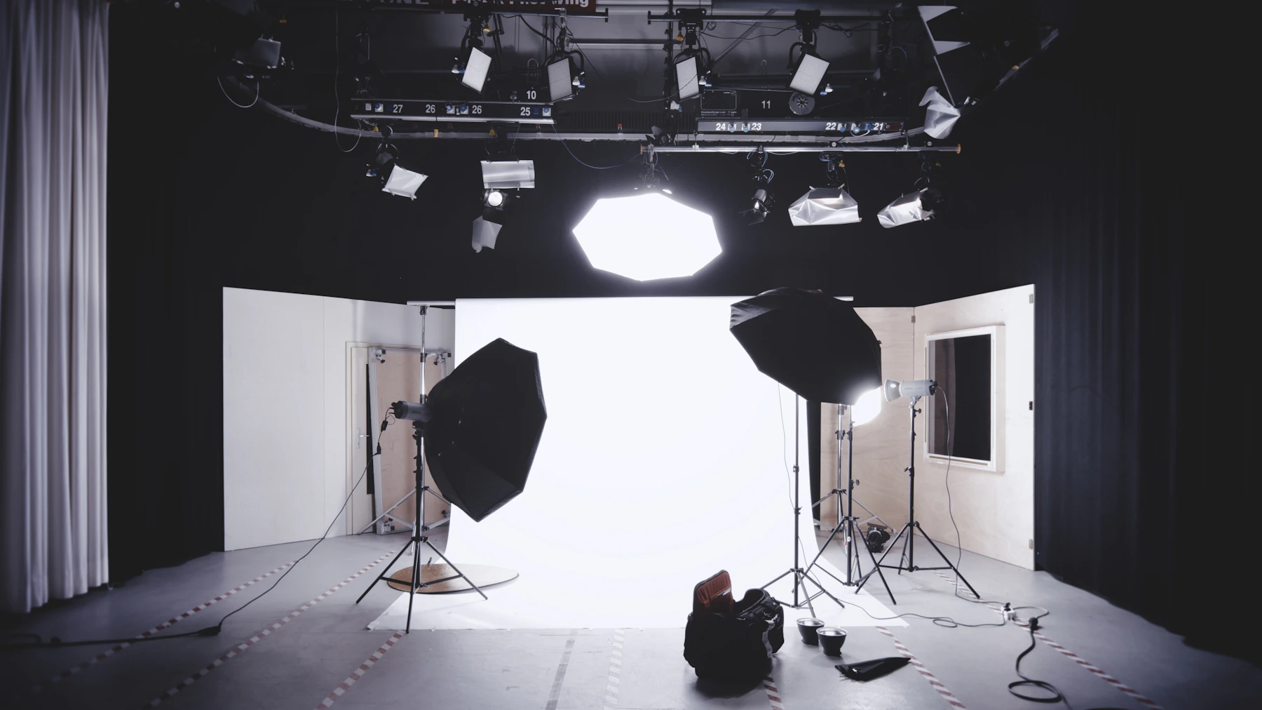 Photo studio with softboxes and a white background