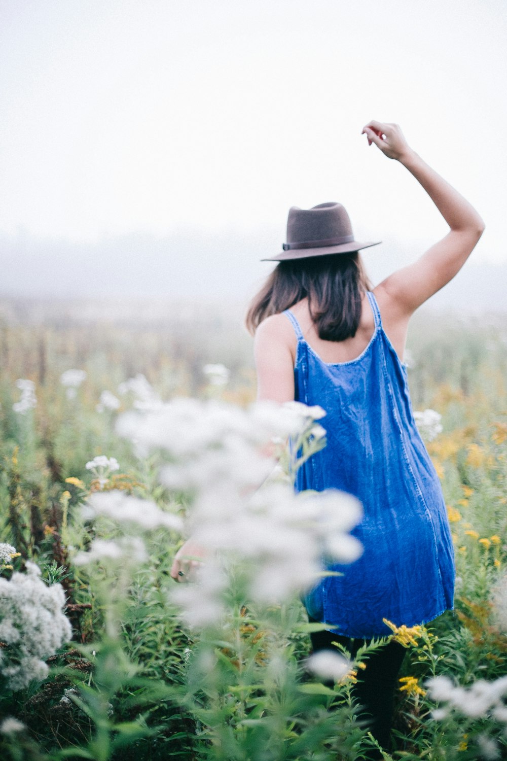 woman walking a flower field