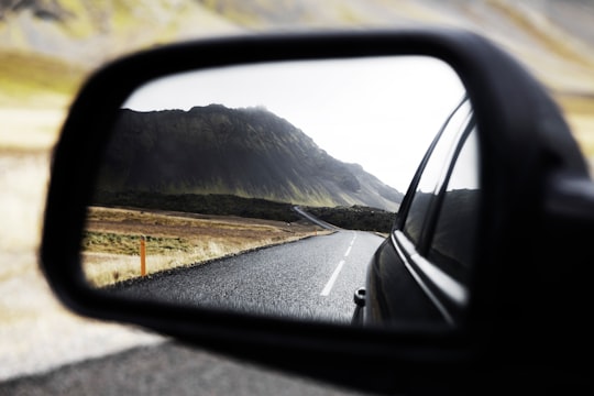 black wing mirror showing road in Snæfellsjökull Iceland