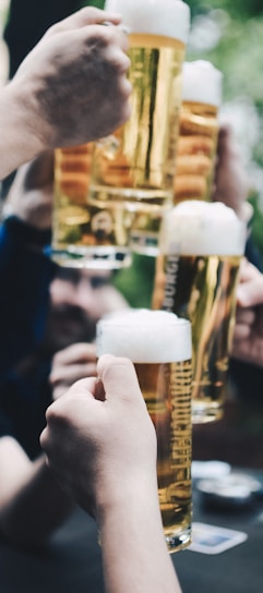 five beer mug filled with beer