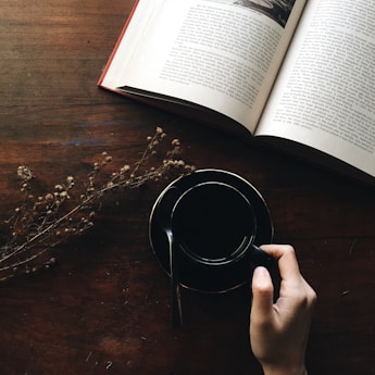 round black metal container near white book open