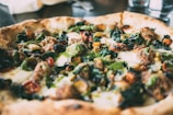 A close-up of a freshly baked pizza with vibrant toppings.