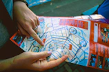 Traveler consulting a map with a guide in a vibrant city street.