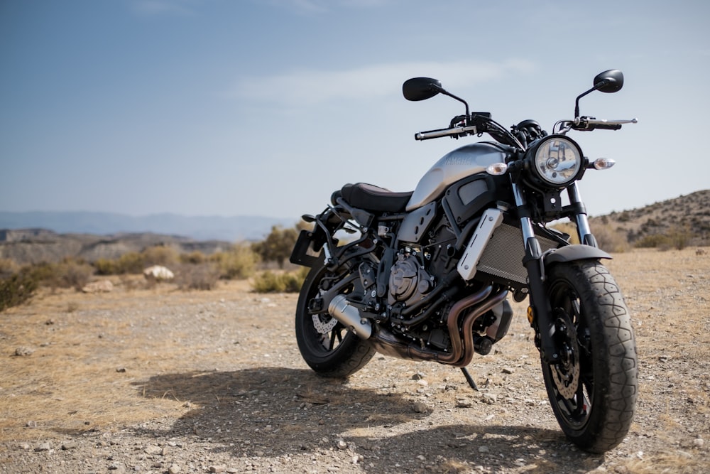 black cruiser motorcycle on soil