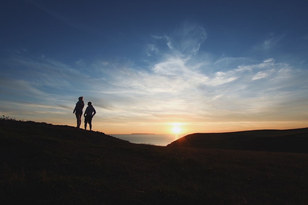 two person silhouette photography